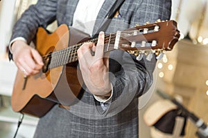 Young guy playing the guitar