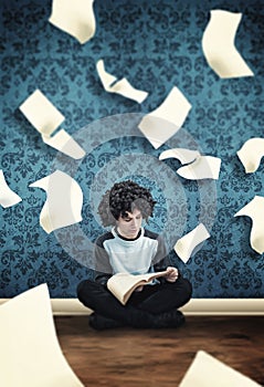 Young guy reading a book