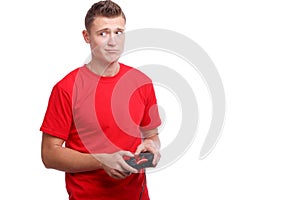 Guy with a joystick in hands looking to the side on a white isolated background