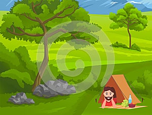 Young guy relaxing lying under tent with picnic food at blanket, happy tourist enjoy nature