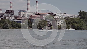 A young guy is riding a hydrocycle on the river