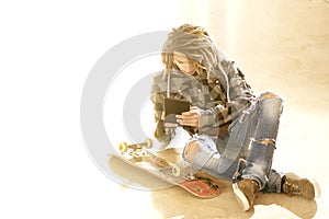 Young guy sitting with digital tablet warm filter applied