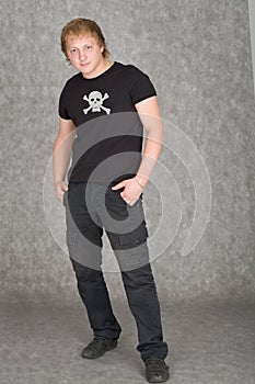 Young guy in a T-shirt with piracy symbolics photo