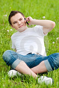 Young guy talking on mobile phone