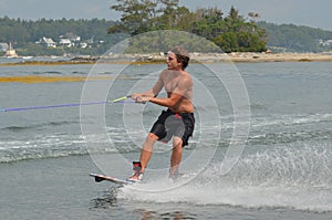 Young Guy Wakeboarding in Casco Bay Maine During the Summer