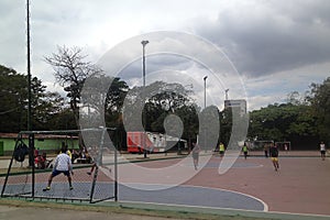 Young guys playing micro soccer in the park