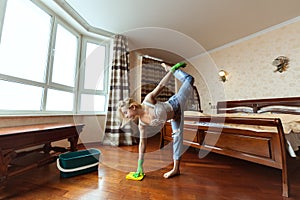 Young gymnast washes floors.