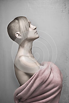 Young hairless woman in towel