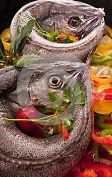 Young hake prepared for cooking with vegetables.
