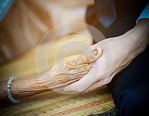 Young hand hold hands of eldery woman