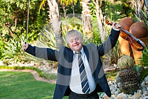 Young handicapped musician raising arms with violin.