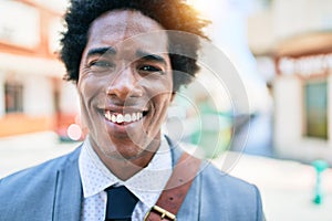 Young handsome african american businessman wearing suit smiling happy