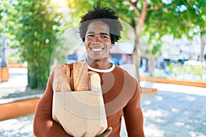 Young handsome african american man smiling happy