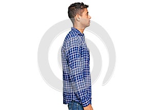 Young handsome african american man wearing casual clothes looking to side, relax profile pose with natural face with confident