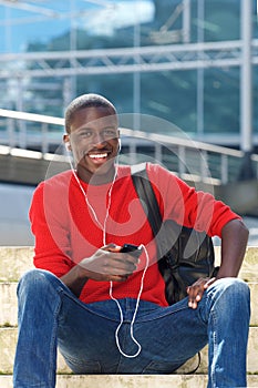 Young handsome african man with mobile phone