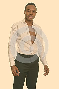 Young handsome African man with shirt open