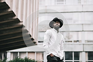 Young handsome afro american boy in stylish hipster hat