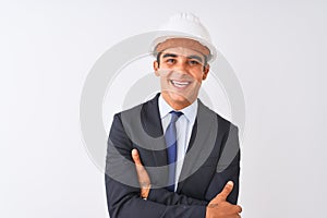 Young handsome architect man wearing suit and helmet over isolated white background happy face smiling with crossed arms looking