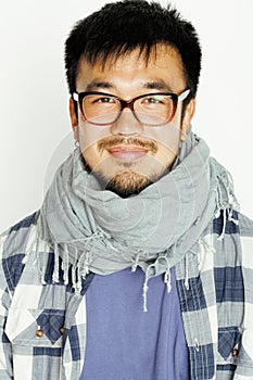 Young handsome asian man hipster in glasses on white background smiling, modern lifestyle concept