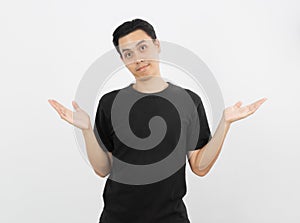 Young handsome asian man making doubts gesture isolated on white background.