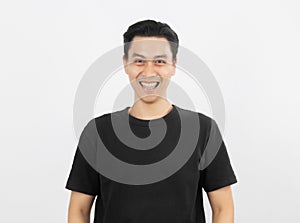 Young handsome asian man smiling with braces and looking at camera isolated on white background.