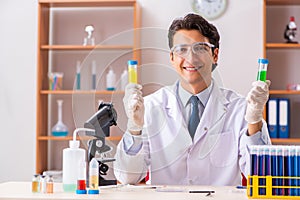 The young handsome biochemist working in the lab