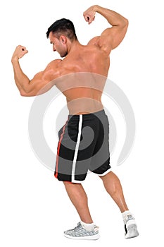 Young handsome bodybuilder man posing for fitness fashion shoot. Isolated on white.