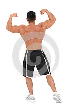Young handsome bodybuilder man posing for fitness fashion shoot. Isolated on white.