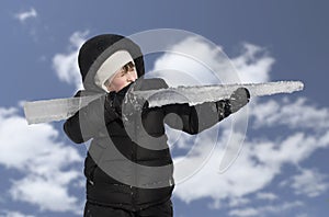 Young handsome boy with ice rifle