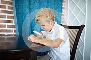 Boy holding a magnifying glass