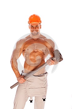 Young and handsome builder with a sledgehammer and