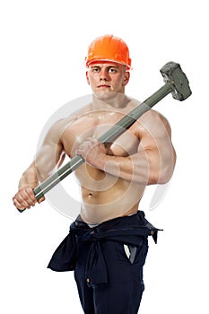 Young and handsome builder with a sledgehammer and body