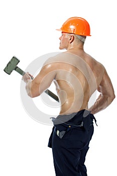 Young and handsome builder with a sledgehammer and body