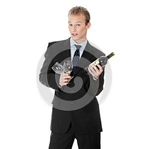 Young handsome business man with bottle of wine