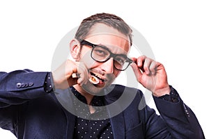 Young handsome business man in glasses bite bitcoin cion isolated on white background