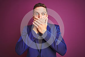 Young handsome business man over purple isolated background shocked covering mouth with hands for mistake