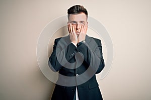 Young handsome business man wearing elegant suit and tie over isolated background Tired hands covering face, depression and