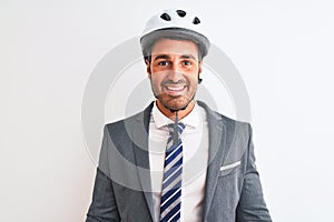 Young handsome business man wearing suit and tie and bike helmet over isolated background with a happy and cool smile on face