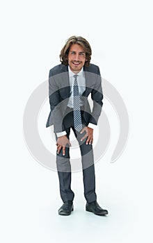 Young handsome businessman bending down.