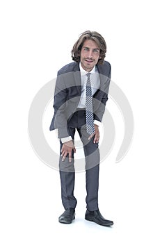 Young handsome businessman bending down.