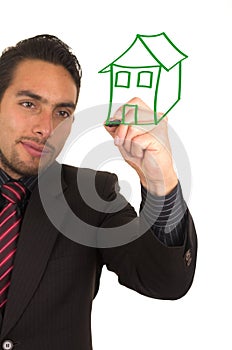 Young handsome businessman drawing on whiteboard