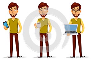 Young handsome businessman in smart casual clothes with laptop, with smartphone and with hot drink.