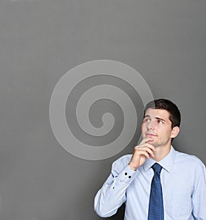 Young handsome businessman thinking