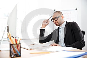 Young handsome businessman thinking about work