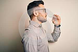 Young handsome businessman wearing glasses and shirt