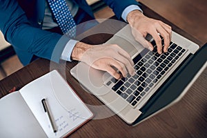 Young handsome businessman working in the office