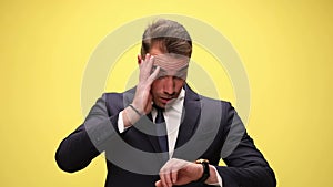 young handsome businessman on yellow background