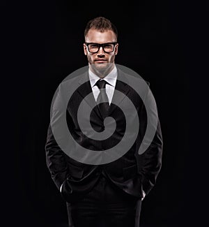 Businessmanman in black suit and glasses