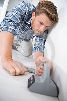 Young handsome carpet fitter