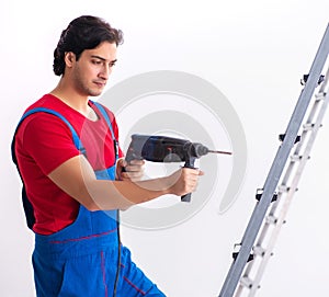 Young handsome contractor working indoors